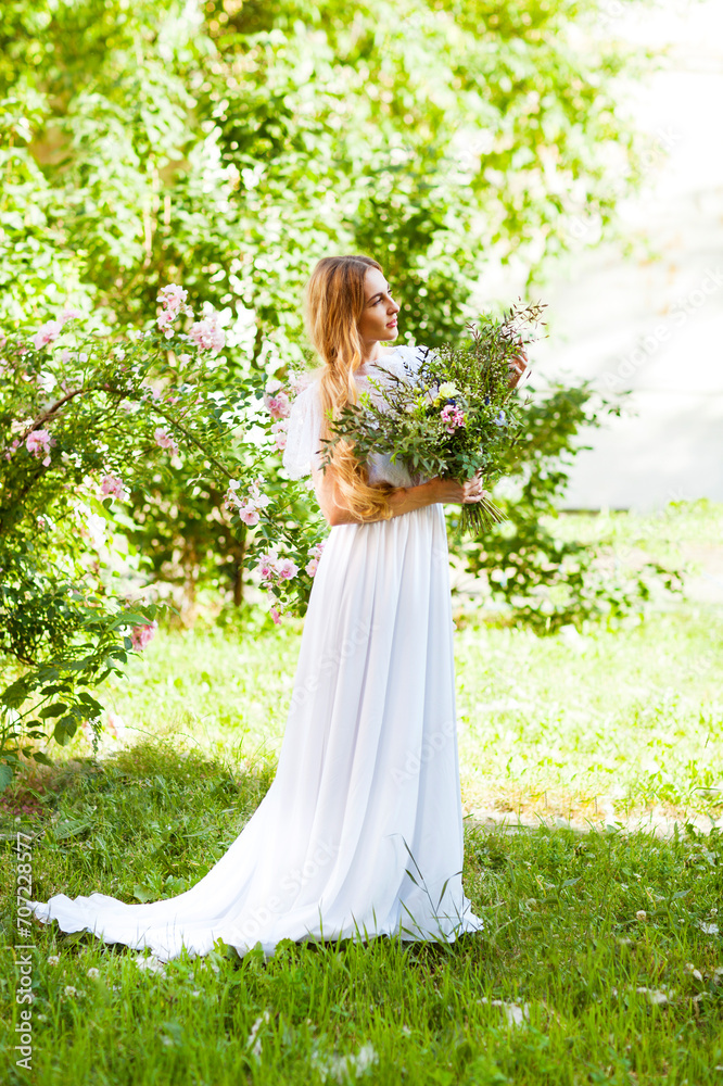 Bride with beautiful wedding bouquet of flowers in the style of boho Bride with beautiful wedding bouquet of flowers in the style of boho