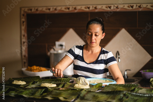 portrait of a woman cooking at home photo