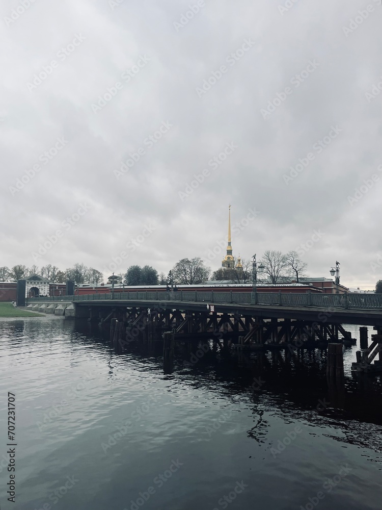 Fototapeta premium Gray sky riverside, city river, melancholic mood