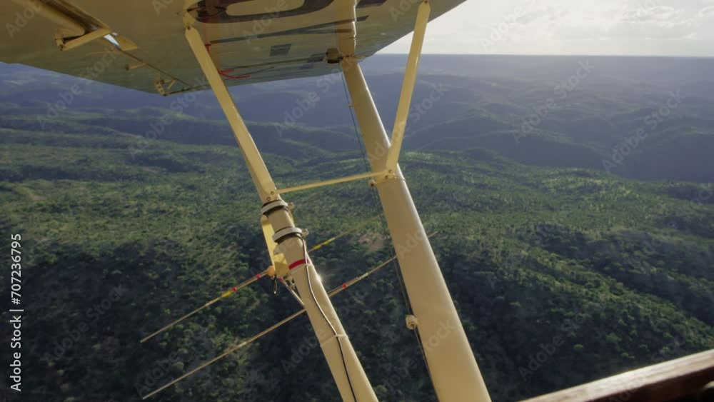 Ariel of valleys within the savannah grassland from a light aircraft during the afternoon in Kenya. Ariel of valleys within the savannah grassland from a light aircraft during the afternoon in Kenya.