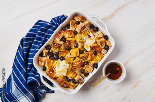 French toast casserole with blueberries, butter and maple syrup  photo