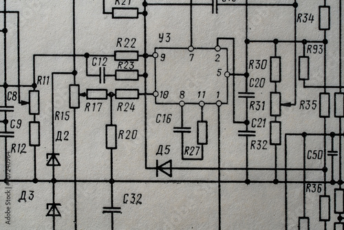 Old radio circuit printed on vintage paper electricity diagram as background. Electric radio scheme from USSR