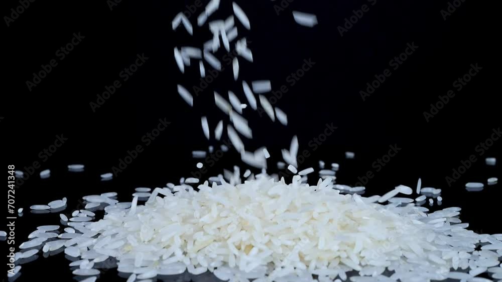 Falling Cooked Rice Basmati white rice falling on a black spinning background. Basmati rice ...