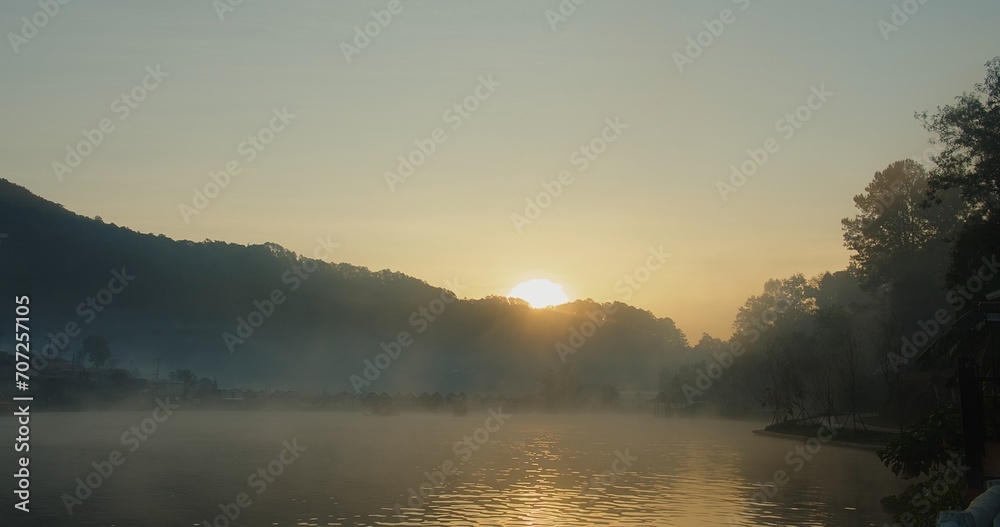 beautiful scenery nature lake with fog mist over water sunrise morning with Chinese style boat at ban rak thai village, enjoy holiday vacation tourism travel countryside in Thailand beautiful scenery nature lake with fog mist over water sunrise morning with Chinese style boat at ban rak thai village, enjoy holiday vacation tourism travel countryside in Thailand