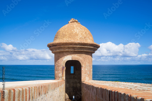 A cannon hole in Castillo San Felipe Del Morro or El Morro in old San Juan city, Puerto Rico. A significant political, iconic, historic location overlooking the Atlantic Ocean. It serve for cannon gun photo