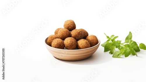 fried organic falafel balls isolated on a white background, a composition or scene in a minimalist modern style, highlighting the textures and flavors of the halafel. photo