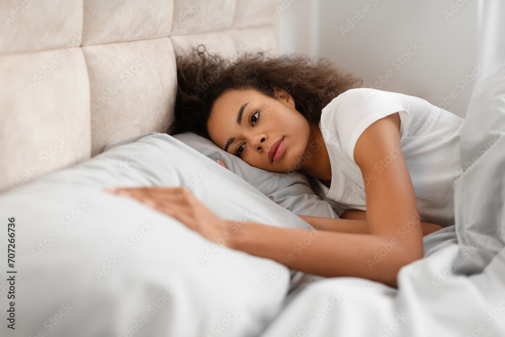 Frustrated Black Lady Touching Empty Pillow Lying In Bed Indoors Frustrated Black Lady Touching Empty Pillow Lying In Bed Indoors