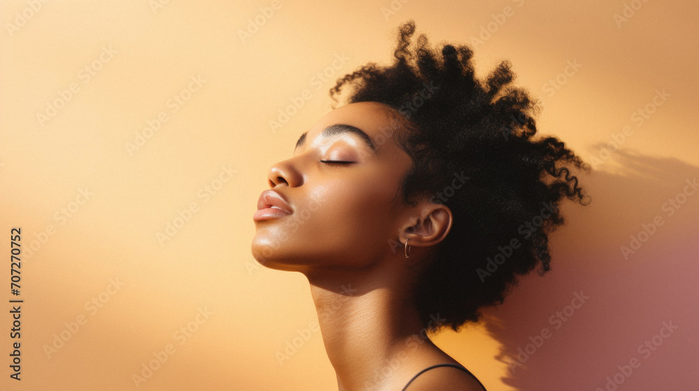 Beautiful african american woman with afro hairstyle on beige background Beautiful african american woman with afro hairstyle on beige background