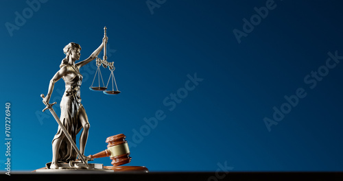 Legal Concept: Themis is the goddess of justice and the judge's gavel hammer as a symbol of law and order photo