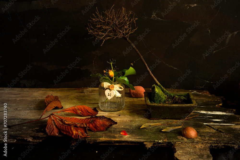 still life with roses, petals, vases, avocado seeds, leaves