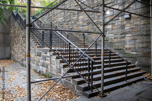 a stair case in the middle of an old building with scaffolding photo