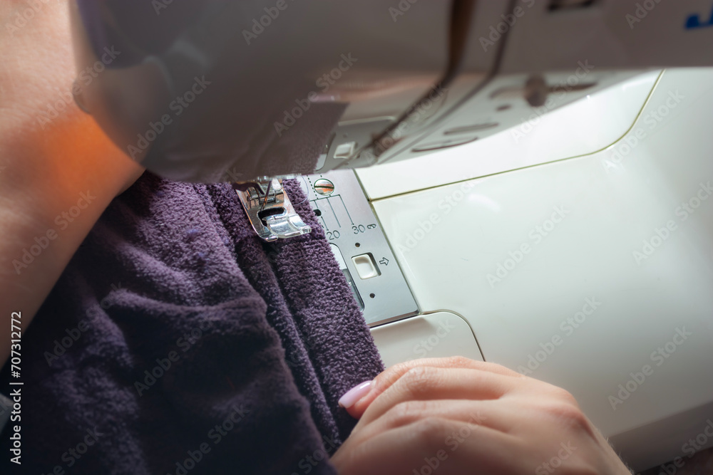 Sewing machine with cloth, close-up. Sewing process