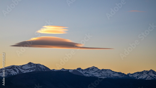 Sunset over the mountains in southern Chile with lenticular clouds