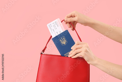 Woman putting Ukrainian pas...