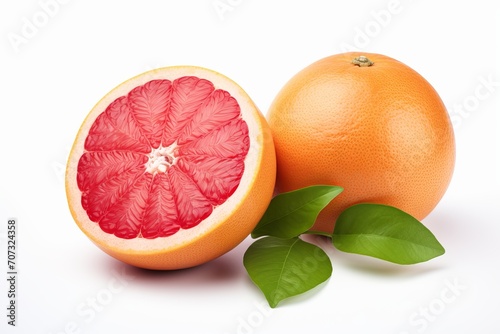 a bunch of several grapefruits with leaves isolated on a white background. halves and whole pink citrus fruits.