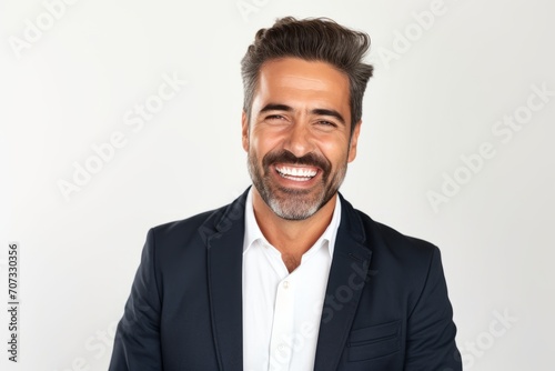Portrait of a happy middle-aged businessman smiling at camera.