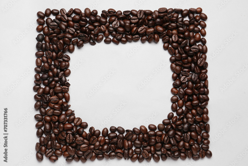 Frame made of coffee beans on grey background Frame made of coffee beans on grey background