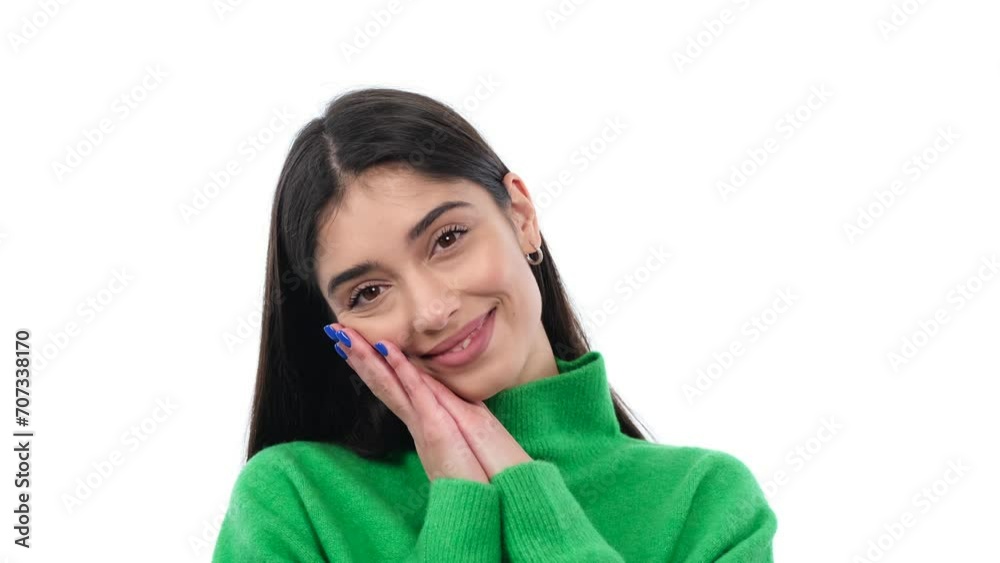 Young woman radiates delight, capturing a sweet and endearing expression against a clean white background. This image conveys a sense of joy and innocence . Young woman radiates delight, capturing a sweet and endearing expression against a clean white background. This image conveys a sense of joy and innocence .