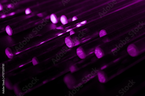 glowing optical violet fiber in the dark