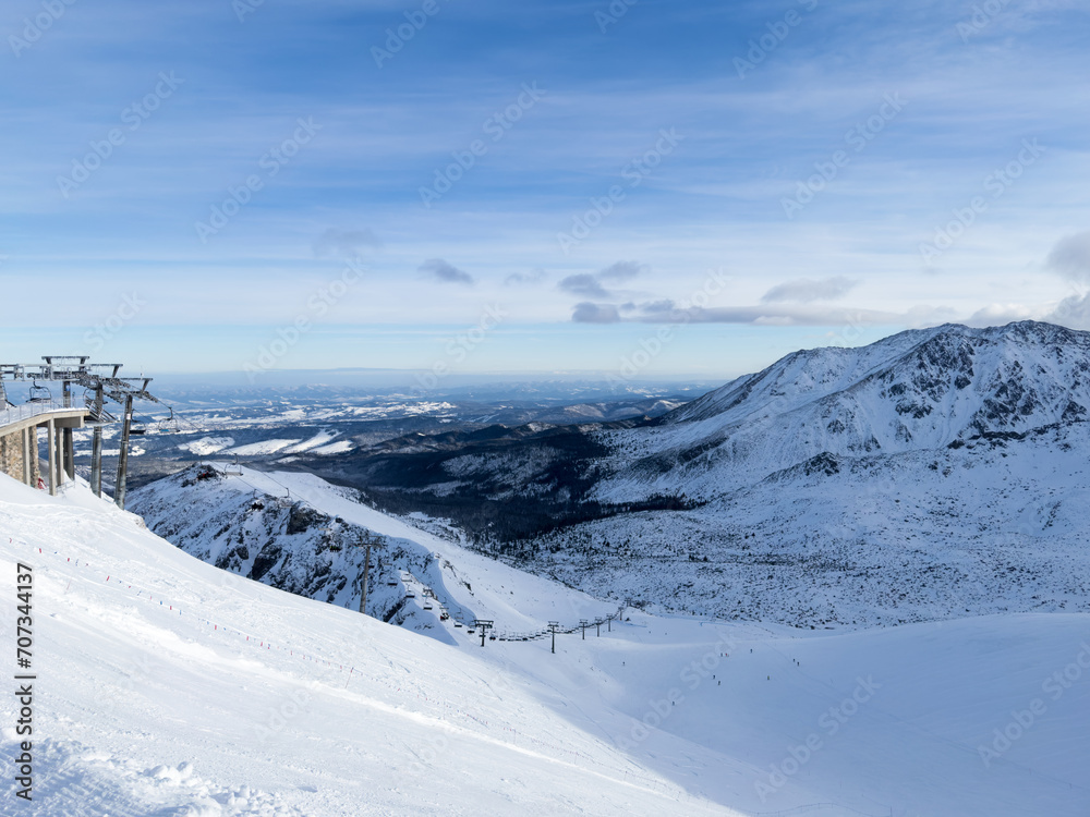 Landscape of the snowy Kasprowy Wierch peak in the Tatras mountain in winter. Ski Lift in Poland mountains, winter sports