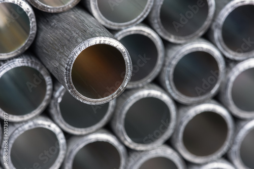 Stack of used aluninum pipes, close-up view