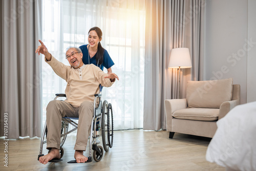 Photos Happy curator person doctor pushing and walk elderly patient freedom raising arm
