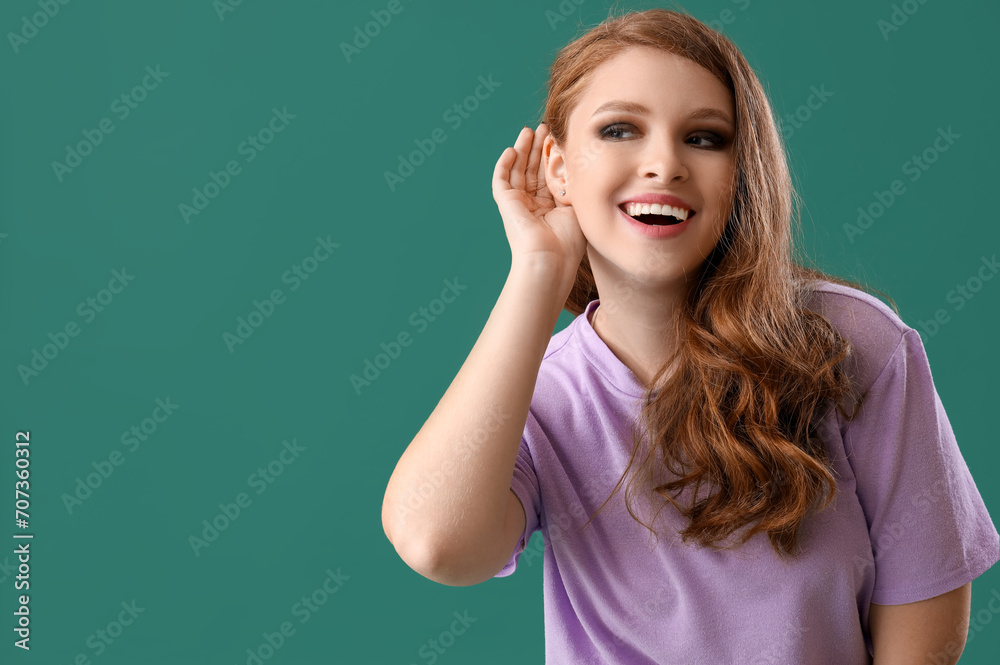 Young gossip woman trying to hear something on green background, closeup Young gossip woman trying to hear something on green background, closeup