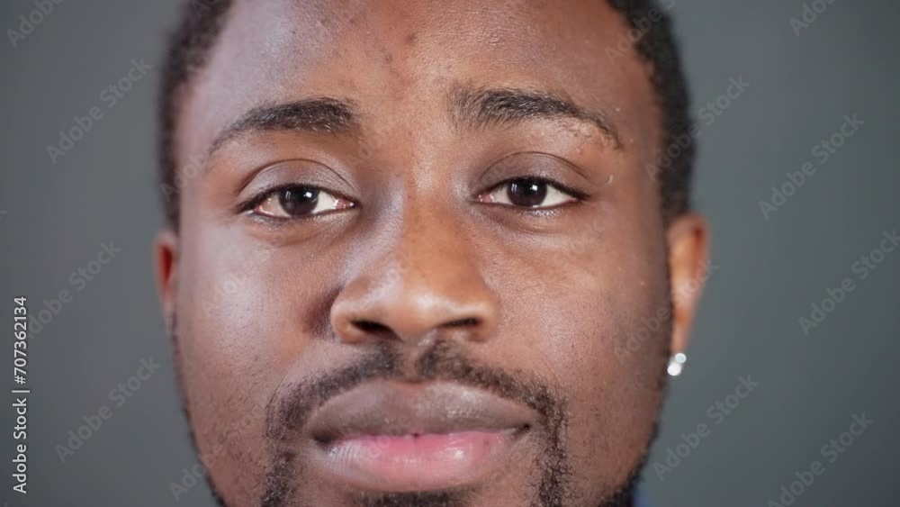 Face of calm friendly african american serious man looking at camera. Face of calm friendly african american serious man looking at camera.