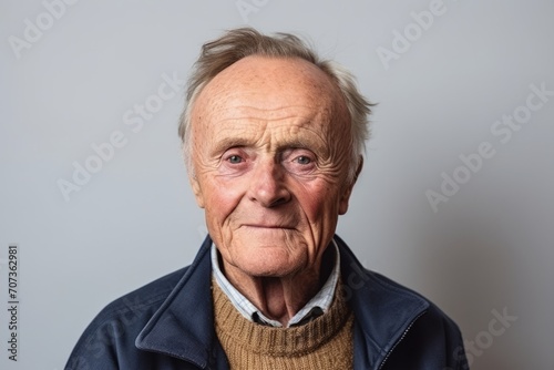 Portrait of an elderly man with grey hair. Studio shot. © Inigo