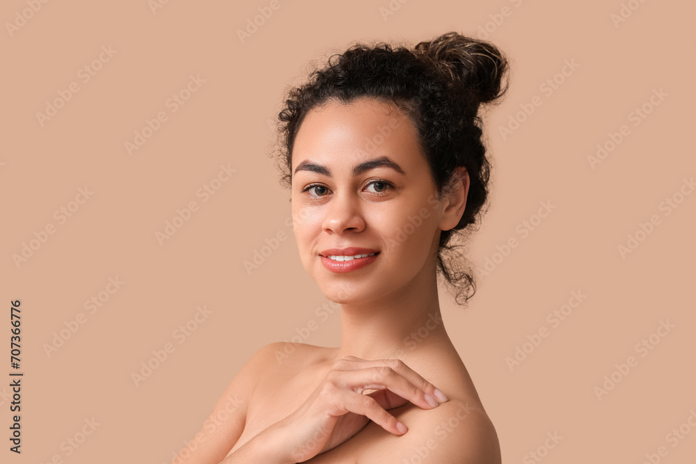 Beautiful young African-American woman on brown background Beautiful young African-American woman on brown background