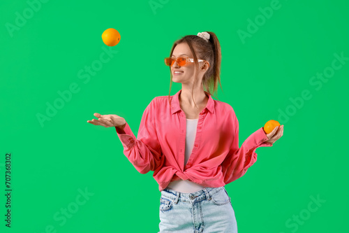 Pretty young woman with ora...