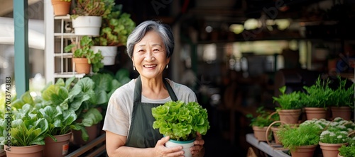 Mature Asian Woman Holding ...