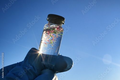 Collecting water samples contaminated with microplastics, plastic pollution 