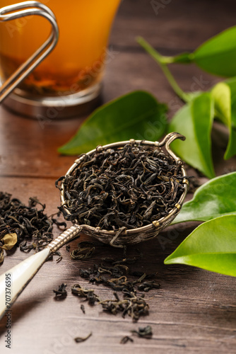 Dry green tea loose leaves. © Inga