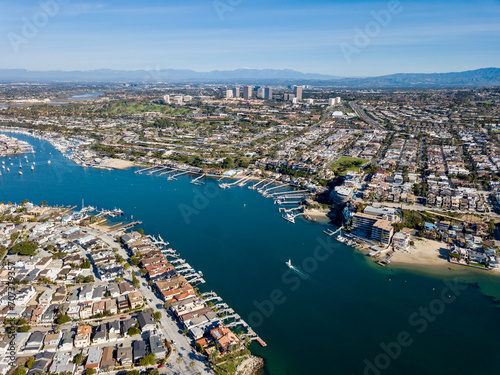 Aerial landscape view of Newport Beach, California homes, buildings and waterways