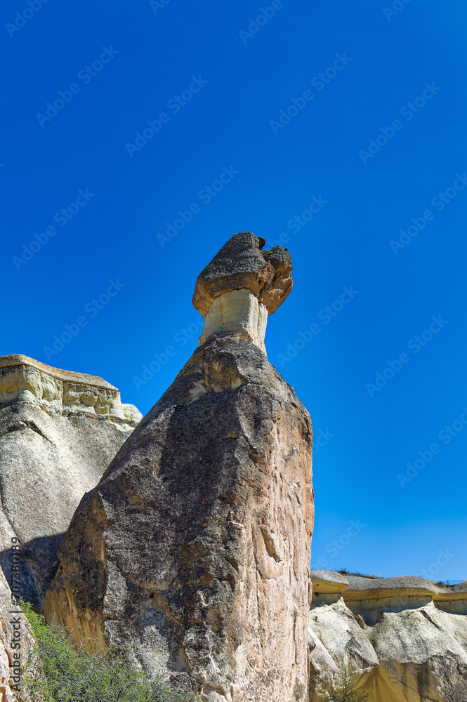 Cappadocia landscape soft volcanic rock, shaped by erosion into towers.