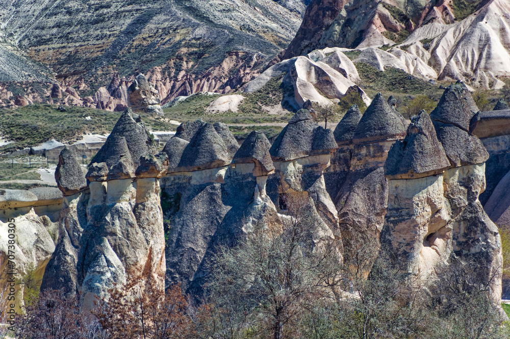 Cappadocia landscape soft volcanic rock, shaped by erosion into towers.