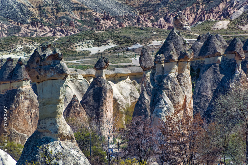 Cappadocia landscape soft volcanic rock, shaped by erosion into towers.