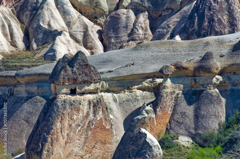 Cappadocia landscape soft volcanic rock, shaped by erosion into towers.