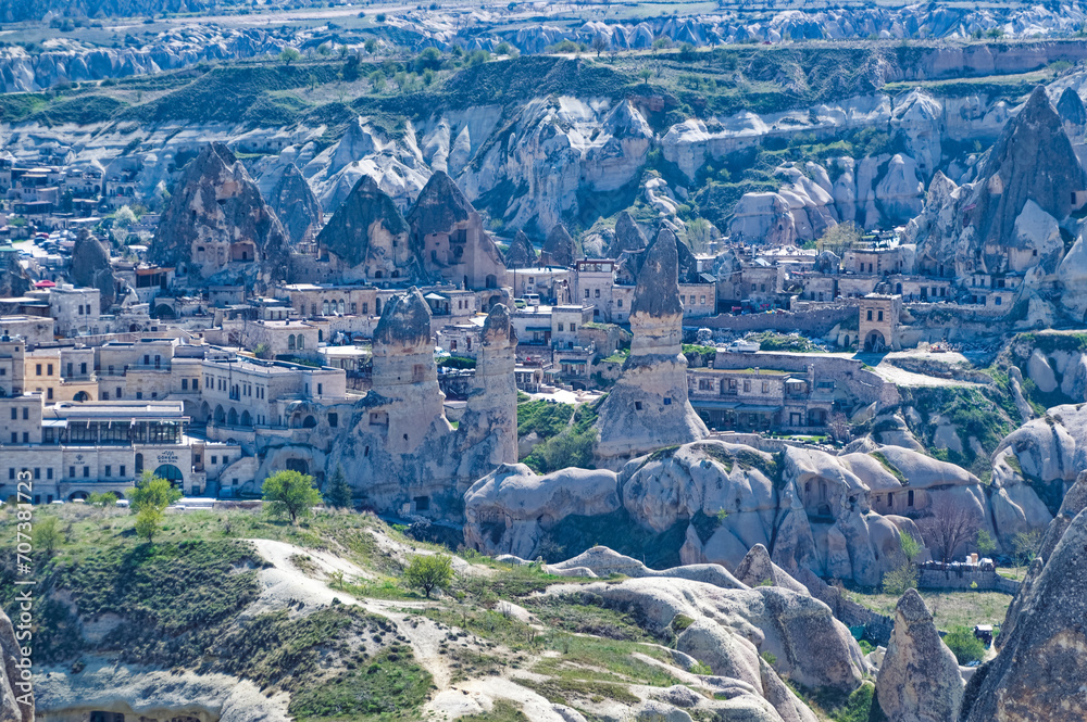Cappadocia landscape soft volcanic rock, shaped by erosion into towers.