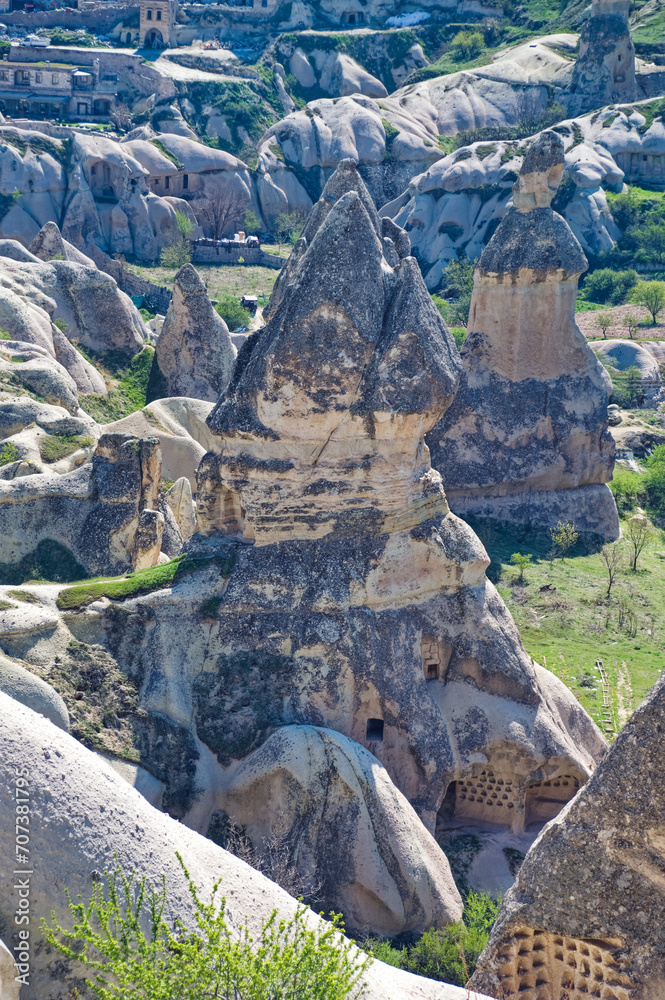 Cappadocia landscape soft volcanic rock, shaped by erosion into towers.