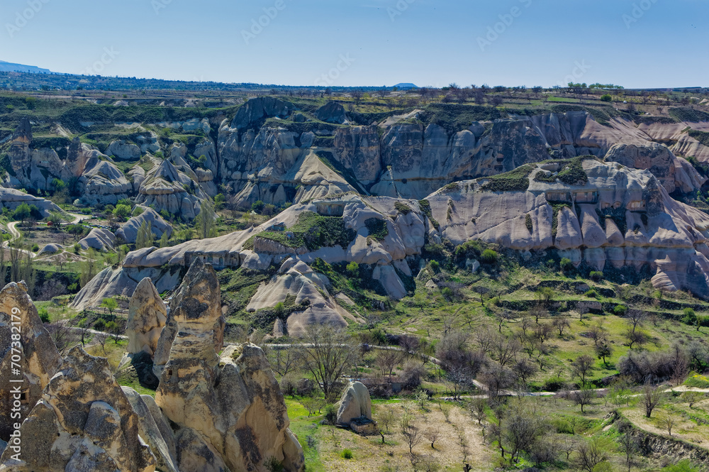 Cappadocia landscape soft volcanic rock, shaped by erosion into towers.