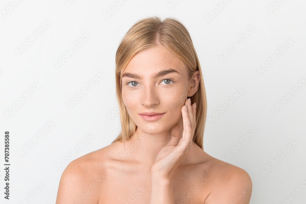 Beautiful Blonde Woman With Smooth Skin Touching Face, White Background Beautiful Blonde Woman With Smooth Skin Touching Face, White Background