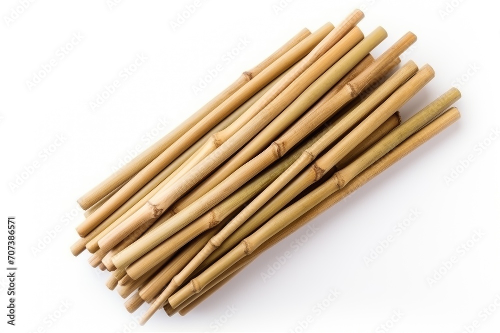 Dry bamboo sticks arranged on white surface from a top perspective Dry bamboo sticks arranged on white surface from a top perspective