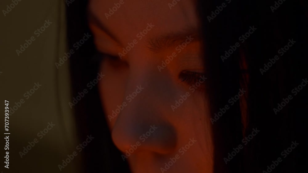 Female face of fashion person, closeup. Beautiful sexy young woman. Asian woman in red light. Urban style Female face of fashion person, closeup. Beautiful sexy young woman. Asian woman in red light. Urban style