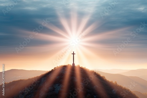 The sun beams radiating behind a lone cross on a hill, evoking feelings of enlightenment and faith, divine light, mountain backdrop