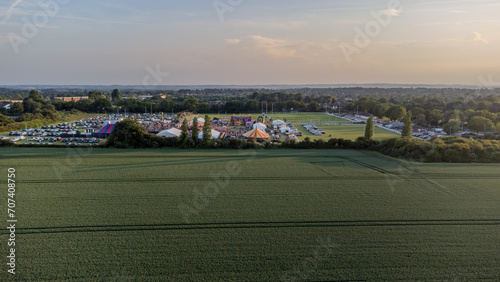 Aerial Drone View of a Festival with Tent in the Background of a Field