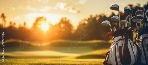The Golf club bag for golfer training and play in game with golf course background. Sunny morning atmosphere. Copy space for text.