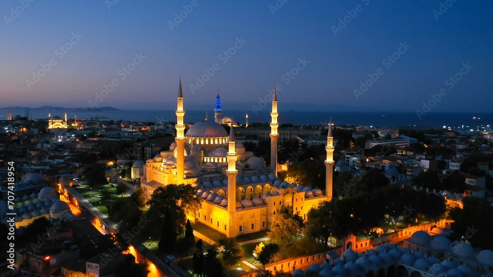 Süleymaniye Mosque built by Architect Sinan in 16th century in Istanbul, Turkey. Drone flies towards illuminated Suleymaniye Mosque on a Ramadan early morning. Aerial view
Süleymaniye Mosque built by Architect Sinan in 16th century in Istanbul, Turkey. Drone flies towards illuminated Suleymaniye Mosque on a Ramadan early morning. Aerial view