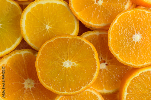 juicy tangerines cut into circles as a background 15